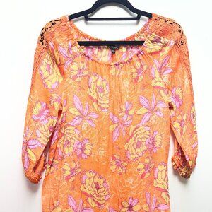 Unique Spectrum orange floral top in small